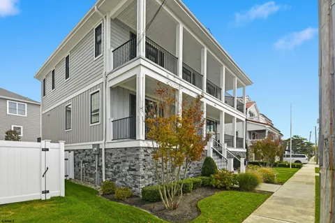a view of a patio with wooden floor and floor to ceiling window