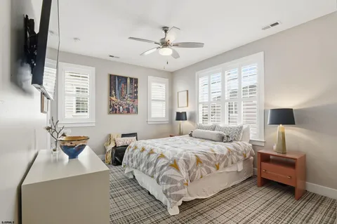 a kitchen with granite countertop white cabinets white stainless steel appliances with a sink and dishwasher