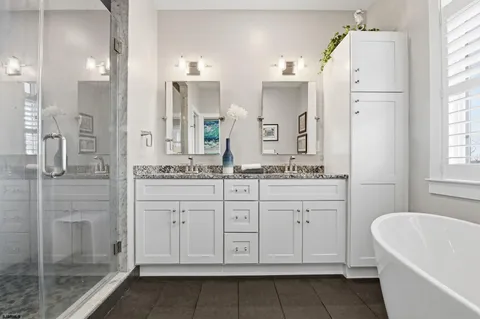 a kitchen with lots of wooden furniture appliances and dining table