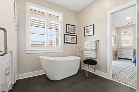 a bathroom with a shower and a sink