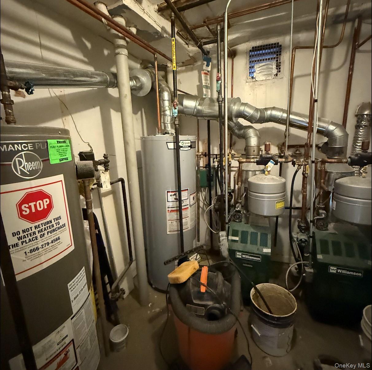 43-24 163rd Street Queens, NY 11358 - Photo 10 of 12 Utility room featuring gas water heater and a heating unit