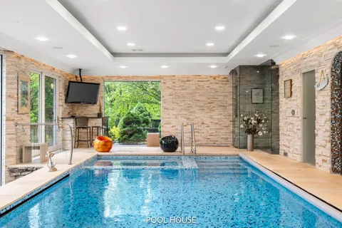 a front view of a house with a yard and plant