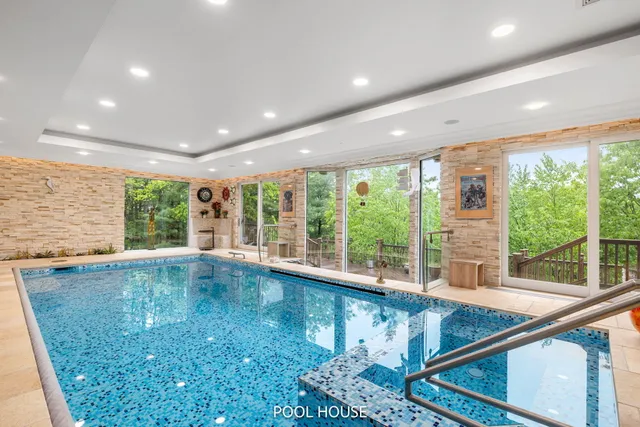a living room with lots of furniture and a chandelier