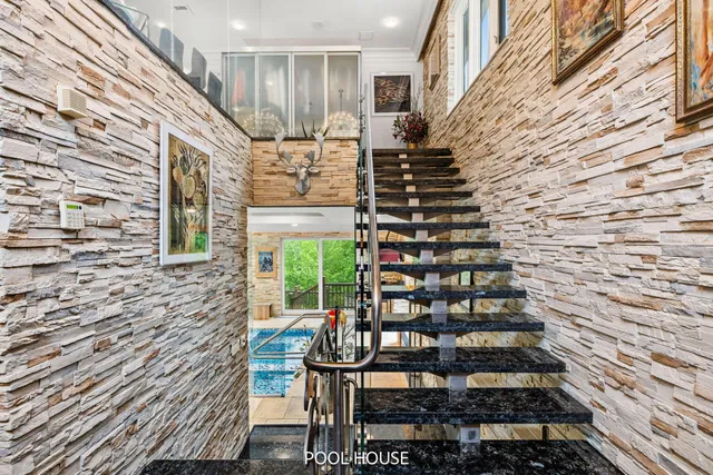 a kitchen that has a lot of cabinets a sink and appliances