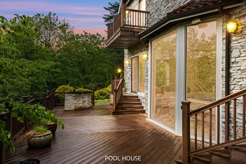 a dining room with furniture a rug and wooden floor