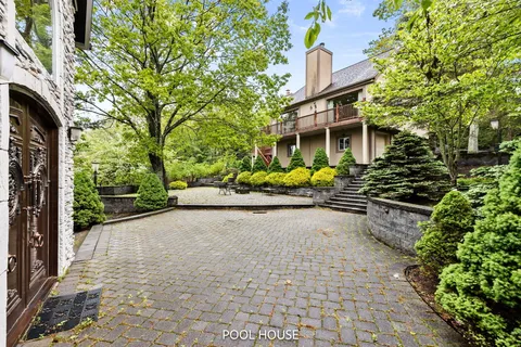 a living room with furniture a table and a large window