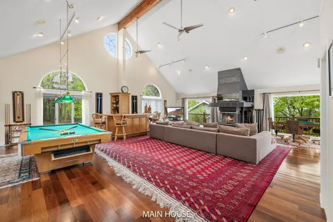 a view of a livingroom with furniture and staircase