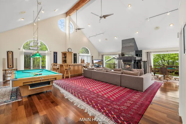 a view of a livingroom with furniture and staircase