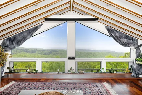a living room with furniture rug and wooden floor