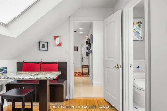 an aerial view of a house with swimming pool and garden view