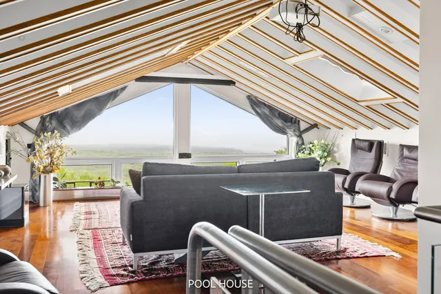 a bedroom with a bed and a flat tv screen