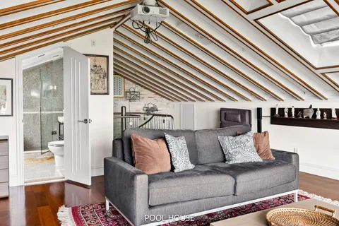 a view of a balcony with chair and front door