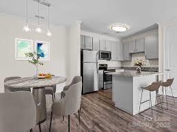 2778 2nd Street Northeast Hickory, NC 28601 - Photo 13 of 20 a kitchen with refrigerator and chairs