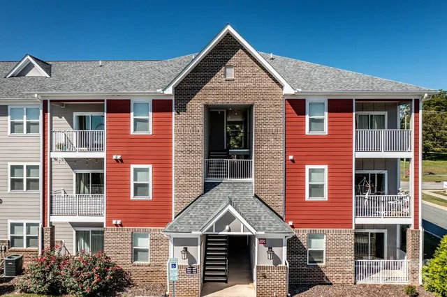 a front view of a house with glass windows and garage