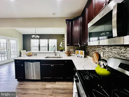a kitchen with a sink and cabinets