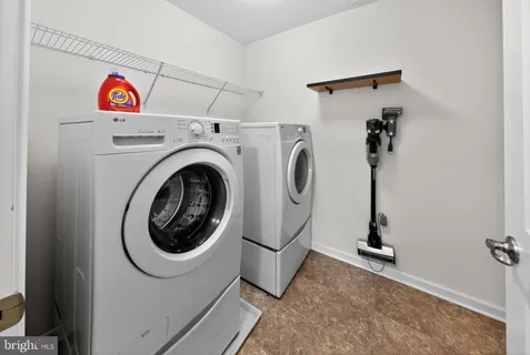 a view of a house with swimming pool and sitting area