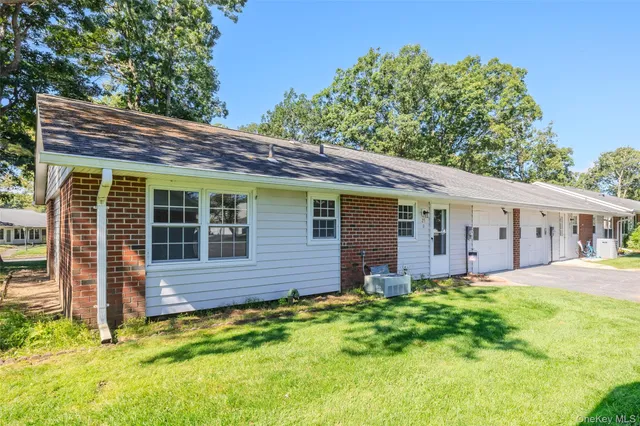 a backyard of a house with yard and barbeque oven