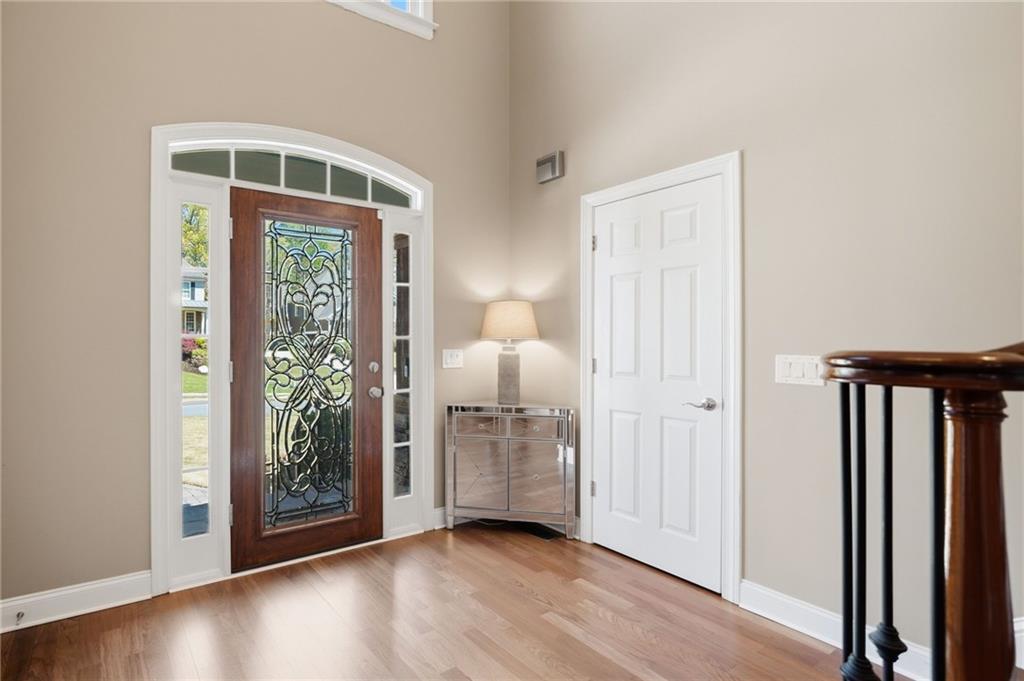 4147 Gold Mill Ridge Canton, GA 30114 - Photo 6 of 93 an empty room with wooden floor closet and windows