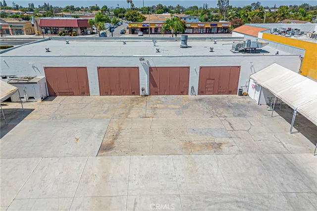 a view of a patio with table and chairs with wooden floor