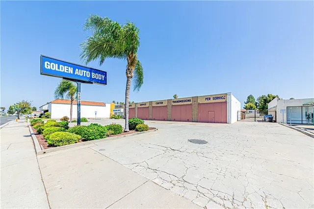 a street sign on a wall next to a road