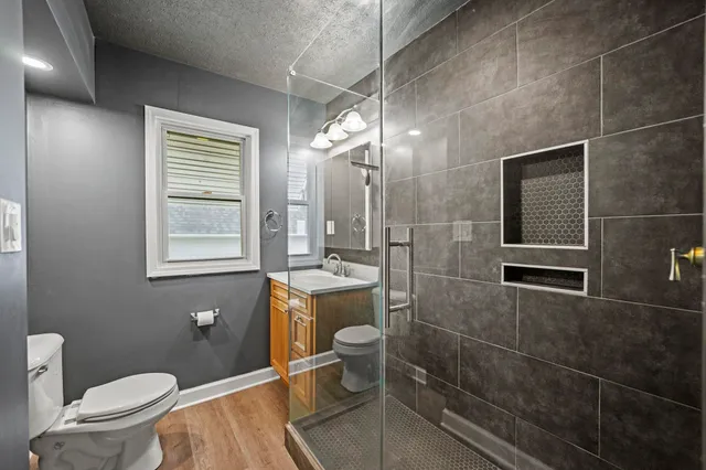 a view of a room with wooden walls