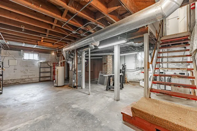 a bathroom with a sink mirror vanity and toilet