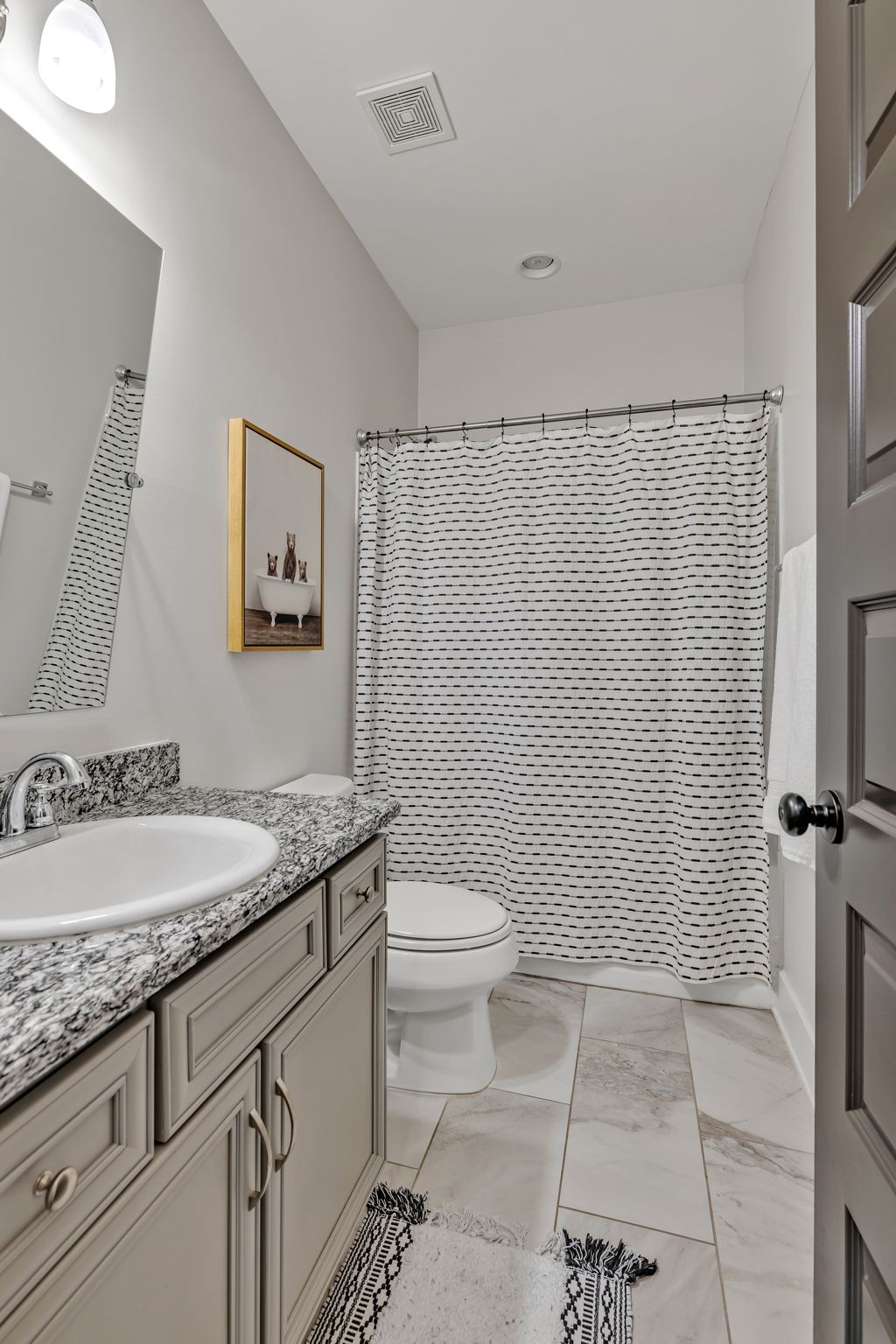 4049 Ryecroft Lane Franklin, TN 37064 - Photo 11 of 34 a bathroom with a granite countertop sink a toilet and a mirror