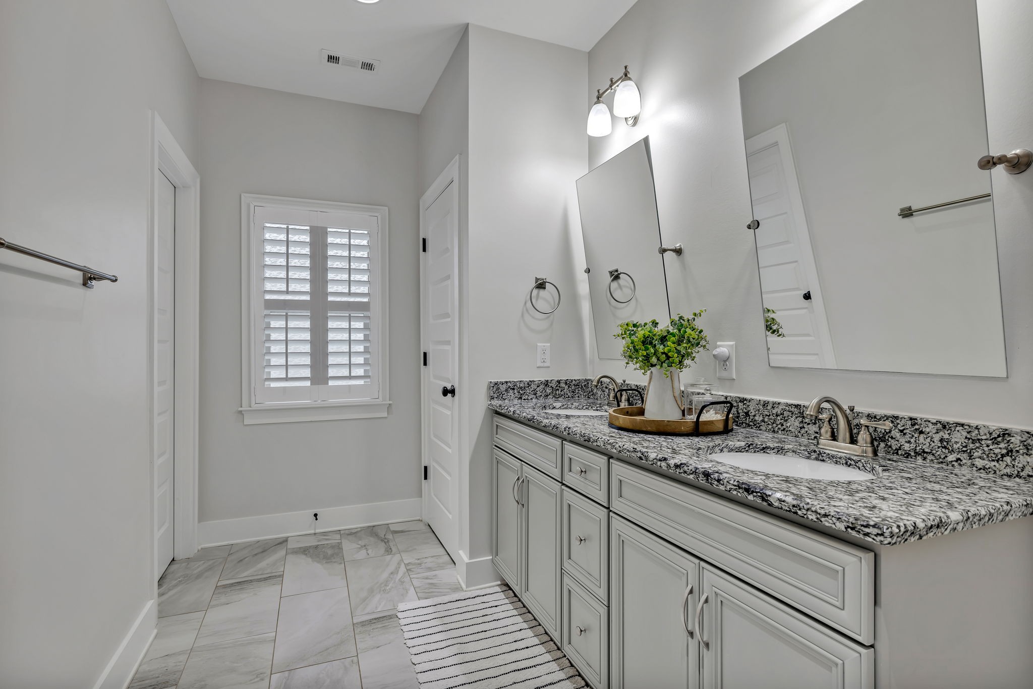 4049 Ryecroft Lane Franklin, TN 37064 - Photo 15 of 34 a bathroom with a granite countertop sink and a mirror