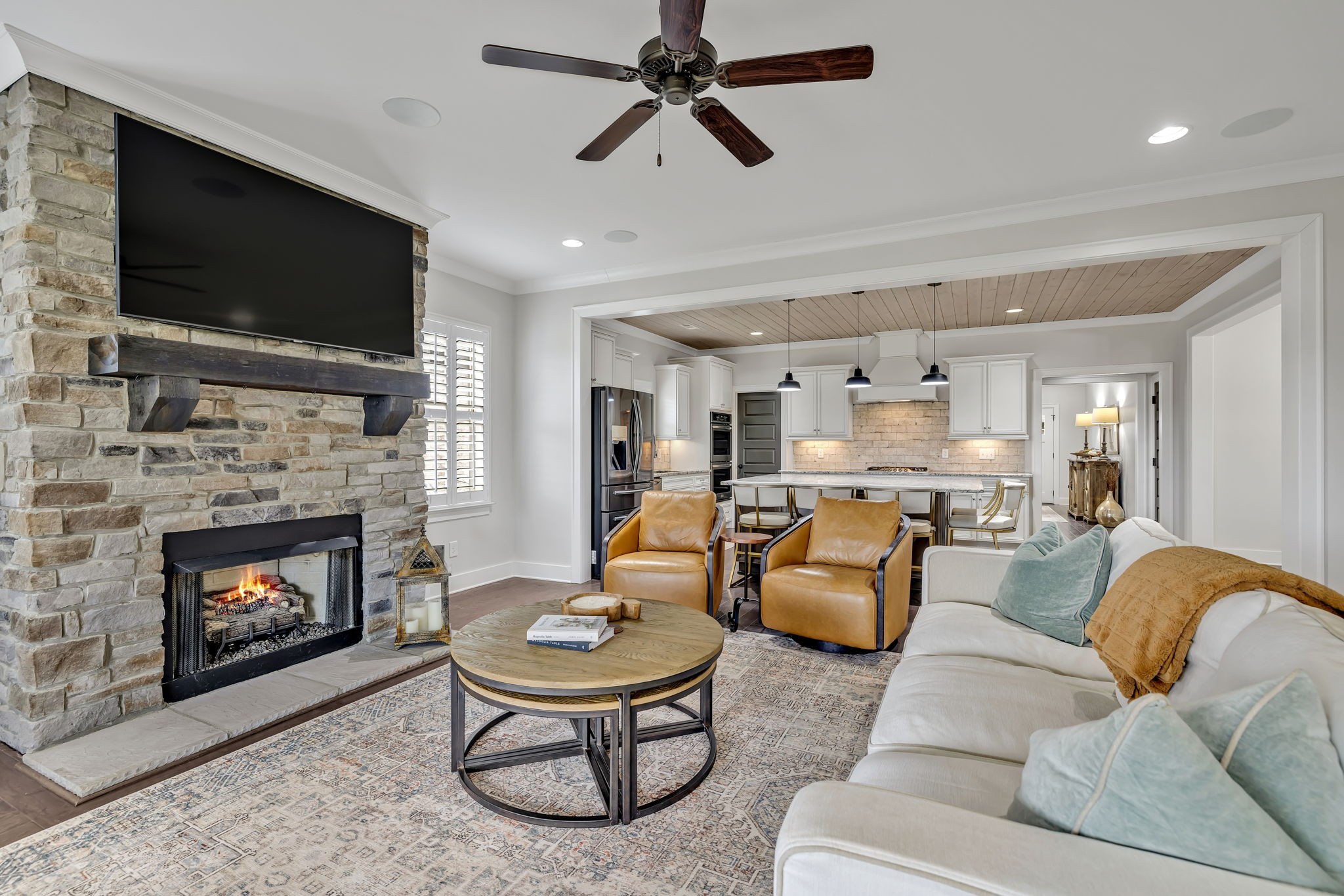 4049 Ryecroft Lane Franklin, TN 37064 - Photo 10 of 34 a living room with furniture a flat screen tv and a fireplace