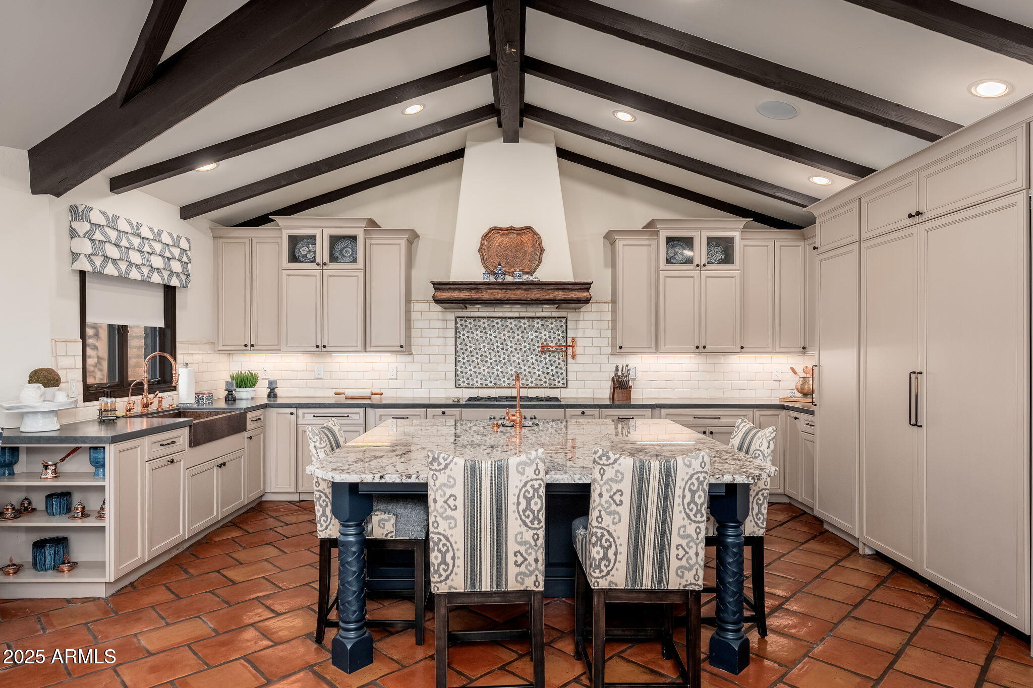 6527 East El Sendero Road Carefree, AZ 85377 - Photo 25 of 93 a kitchen with stainless steel appliances granite countertop a stove a chimney a sink and cabinets