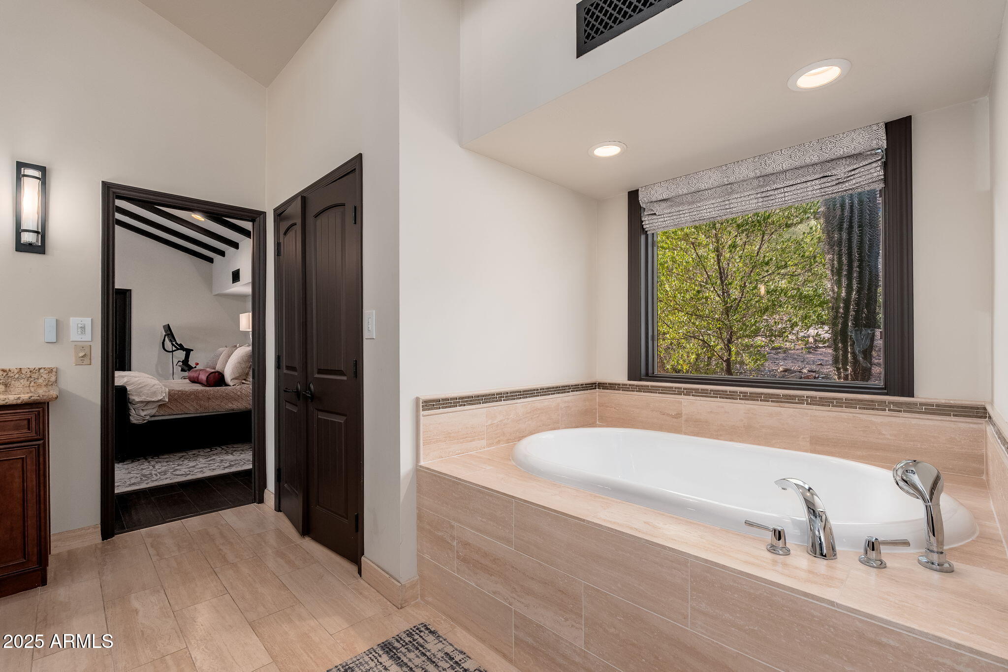 6527 East El Sendero Road Carefree, AZ 85377 - Photo 33 of 93 a bathroom with a tub and a view of bathroom