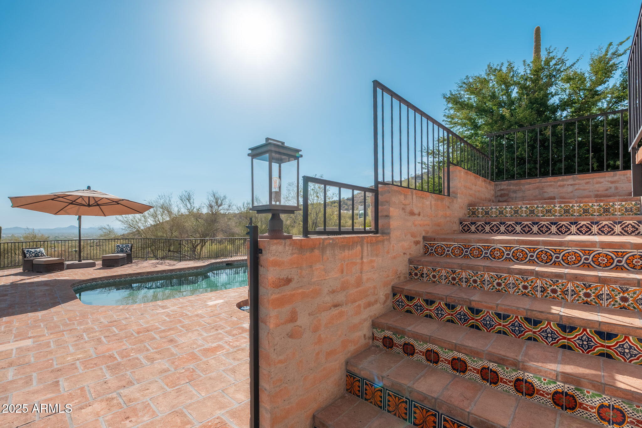 6527 East El Sendero Road Carefree, AZ 85377 - Photo 64 of 93 a view of a porch with furniture and a yard