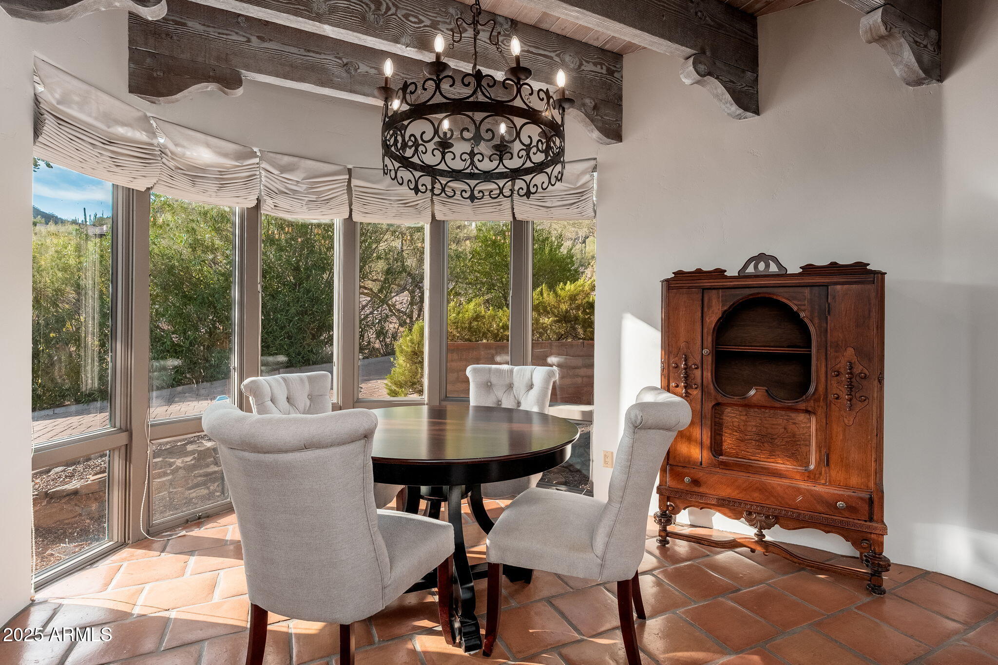 6527 East El Sendero Road Carefree, AZ 85377 - Photo 77 of 93 a dining room with furniture a chandelier and a rug