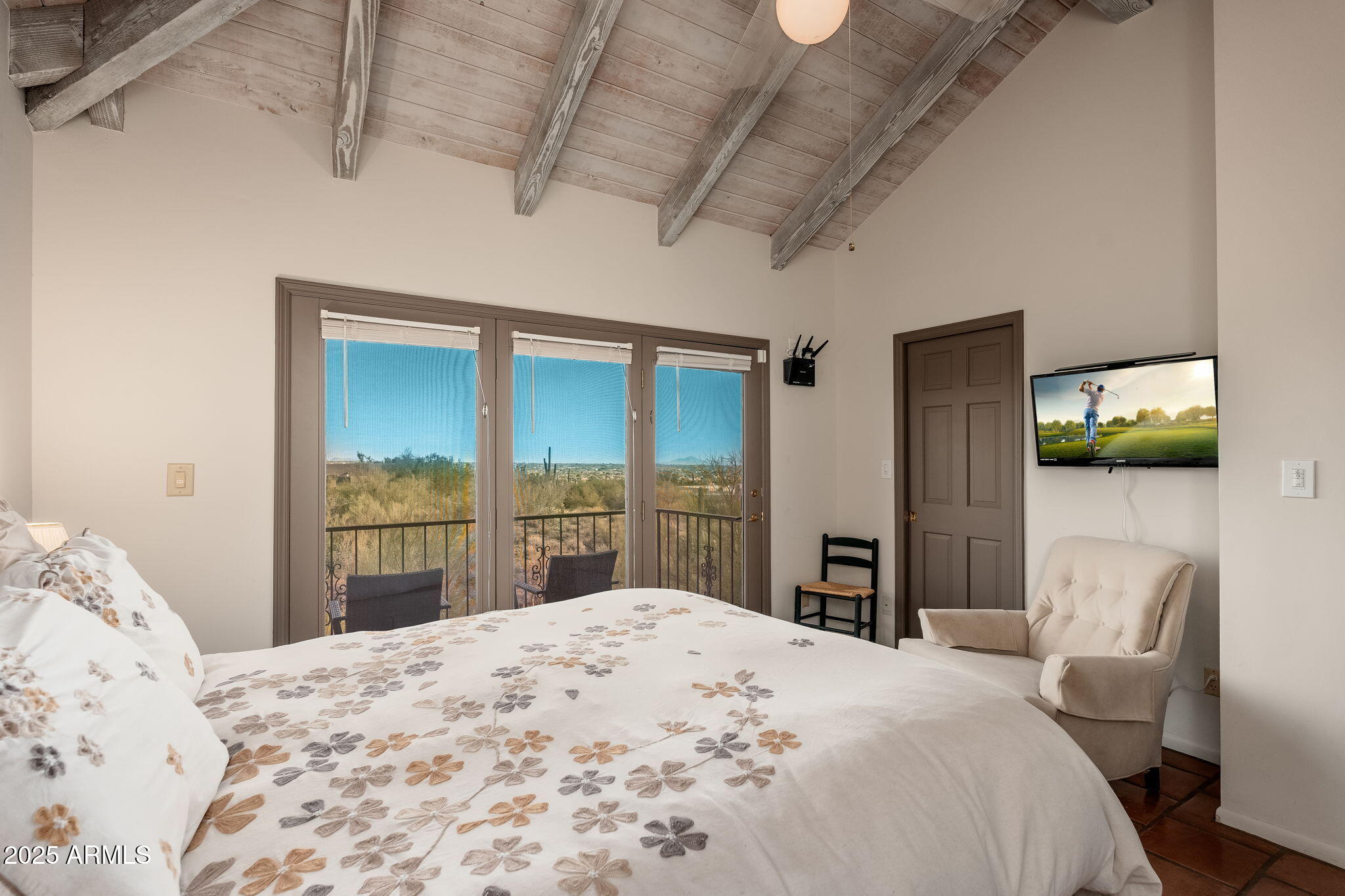 6527 East El Sendero Road Carefree, AZ 85377 - Photo 81 of 93 a bedroom with a bed dresser and a large window