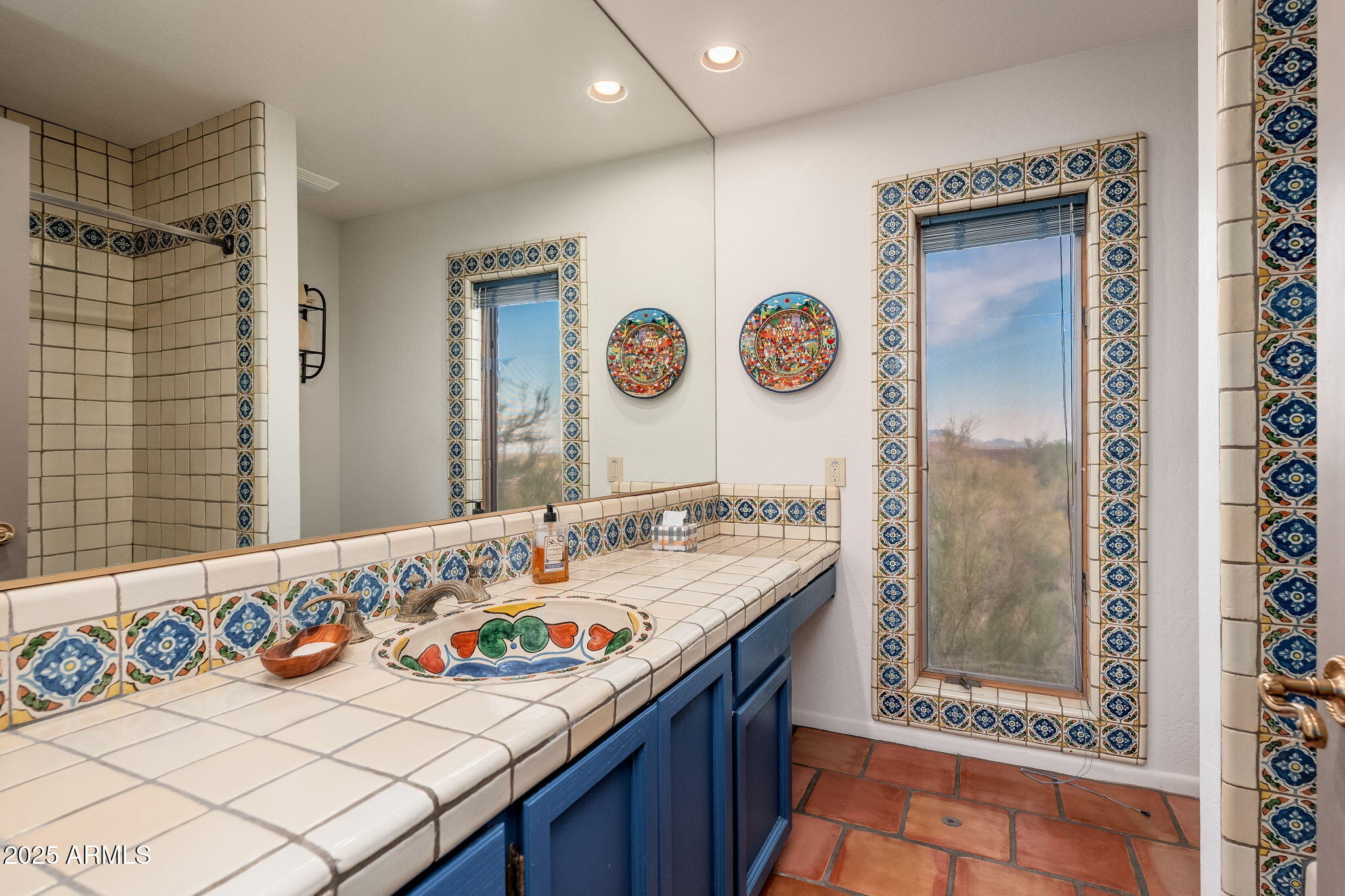 6527 East El Sendero Road Carefree, AZ 85377 - Photo 82 of 93 a bathroom with a sink and a mirror