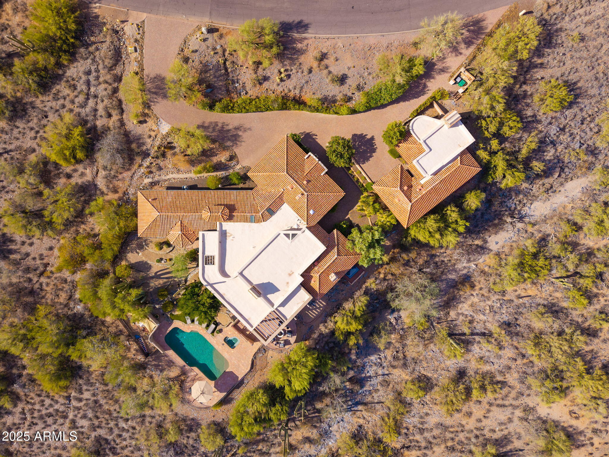 6527 East El Sendero Road Carefree, AZ 85377 - Photo 90 of 93 an aerial view of a house with a yard and trees