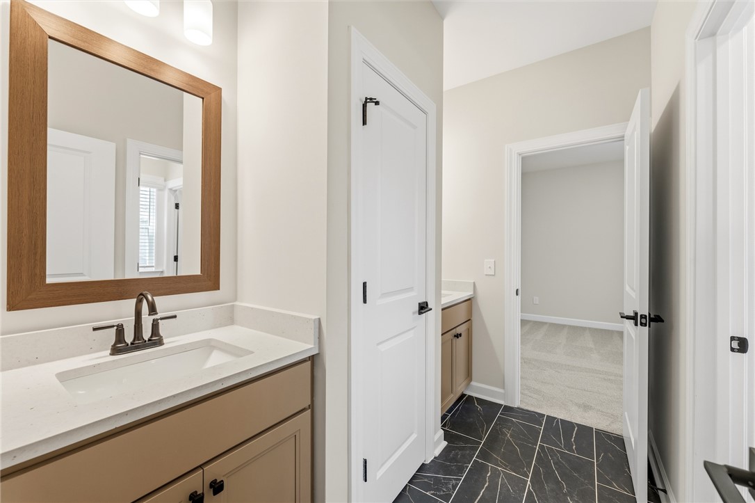 701 Weathered Oak Way Anderson, SC 29621 - Photo 30 of 41 This bathroom features a sophisticated vanity with ample counter space and sleek fixtures.