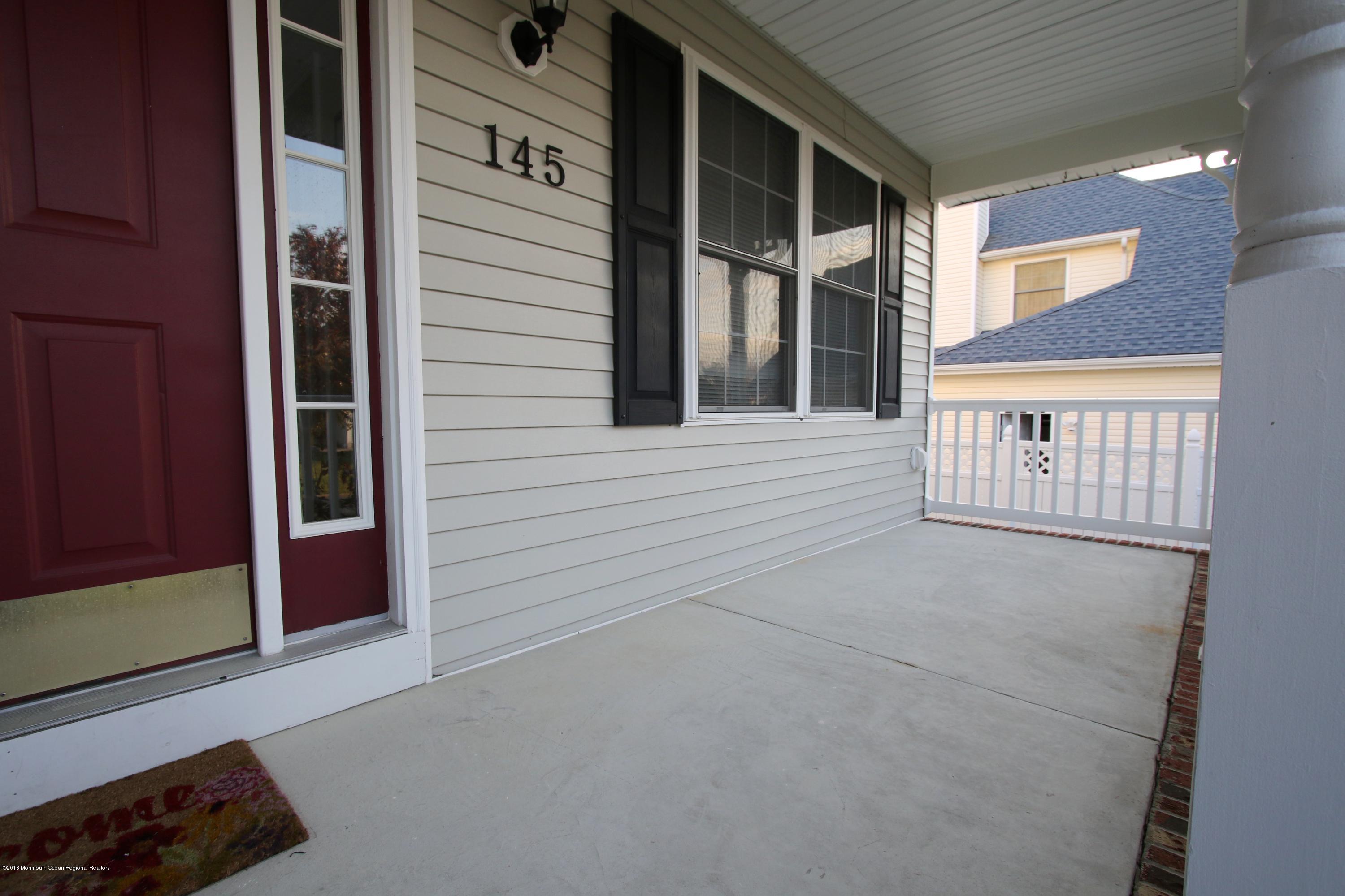 145 Compass Road Manahawkin, NJ 08050 - Photo 3 of 46 a view of front door of house