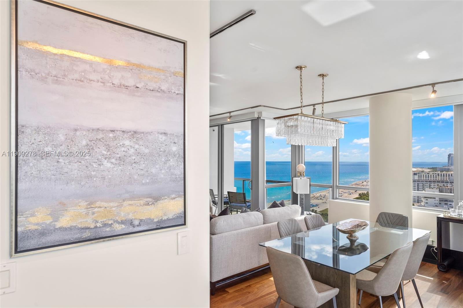 101 20th Street, Unit 3202 Miami Beach, FL 33139 - Photo 1 of 54 a dining room with furniture and a window