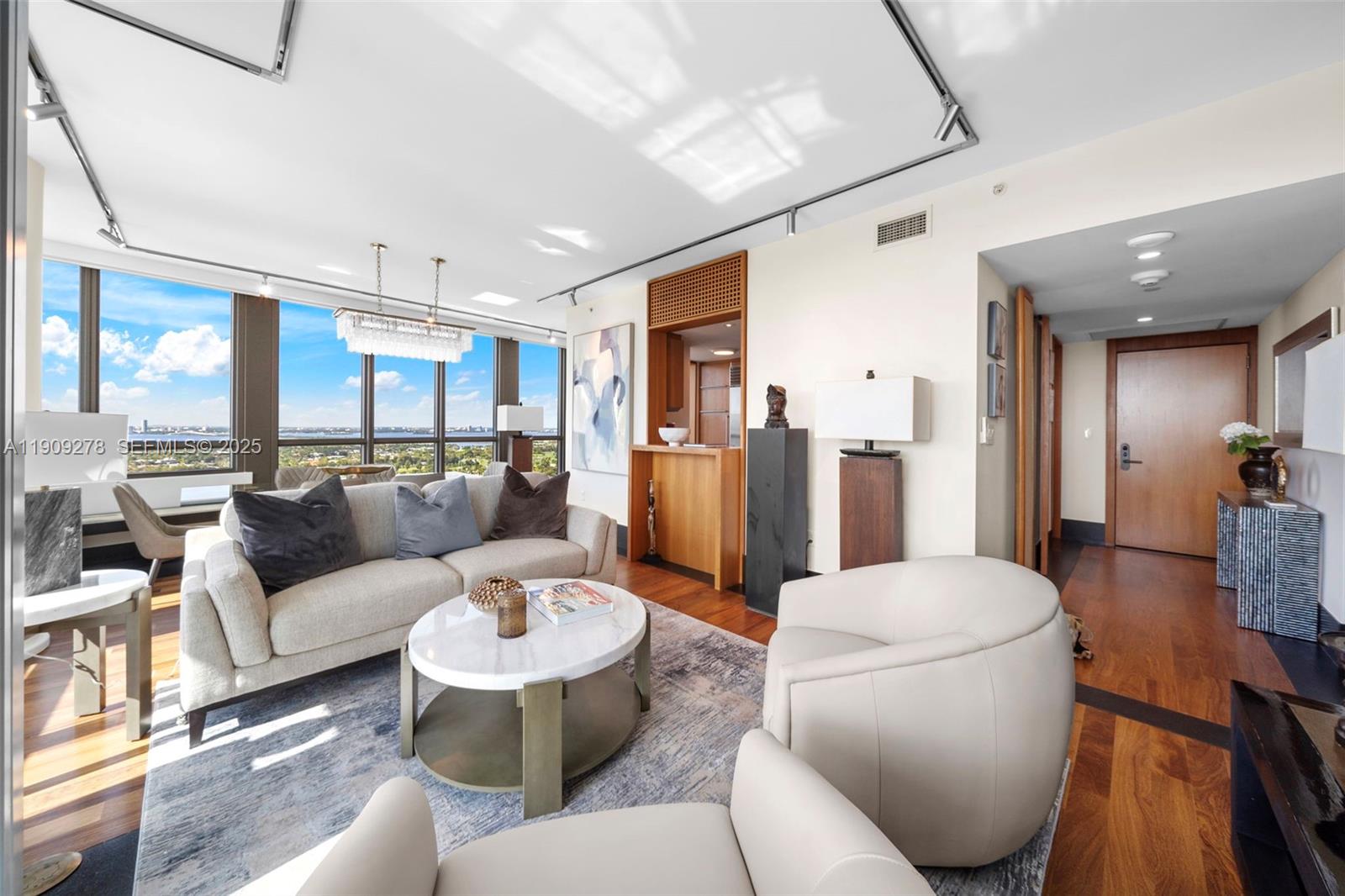 101 20th Street, Unit 3202 Miami Beach, FL 33139 - Photo 11 of 54 a living room with furniture and a view of kitchen