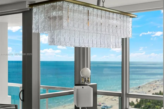 a view of hallway with furniture and a window