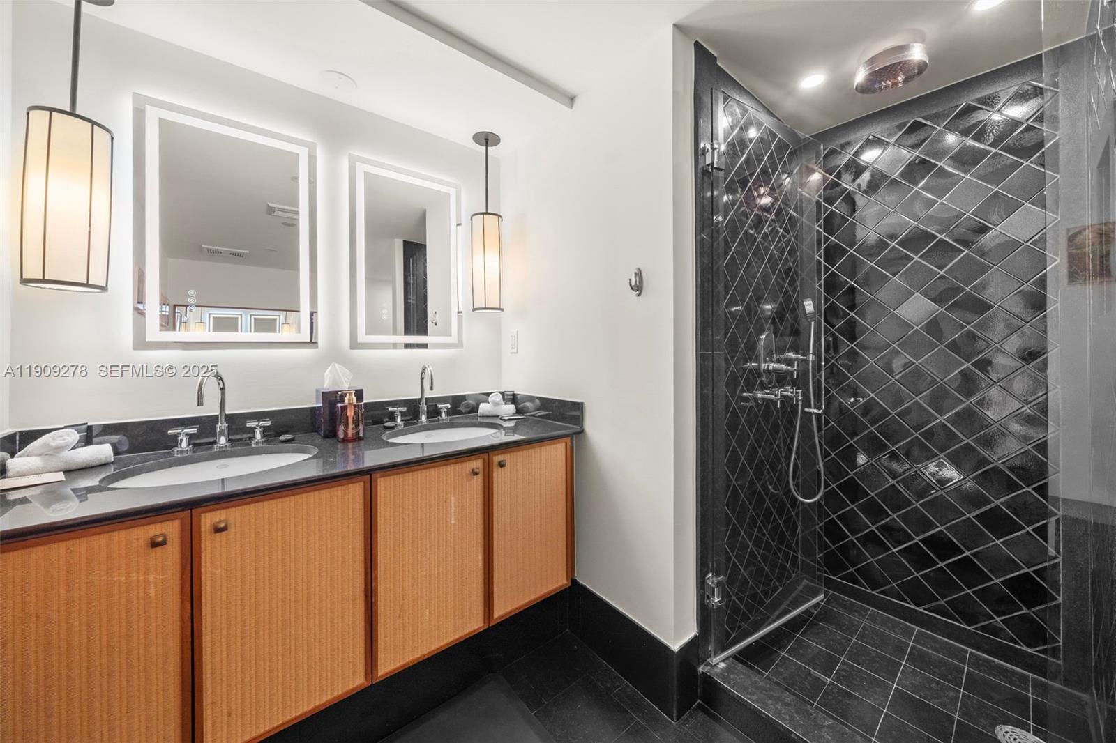 101 20th Street, Unit 3202 Miami Beach, FL 33139 - Photo 33 of 54 a bathroom with a sink and a mirror