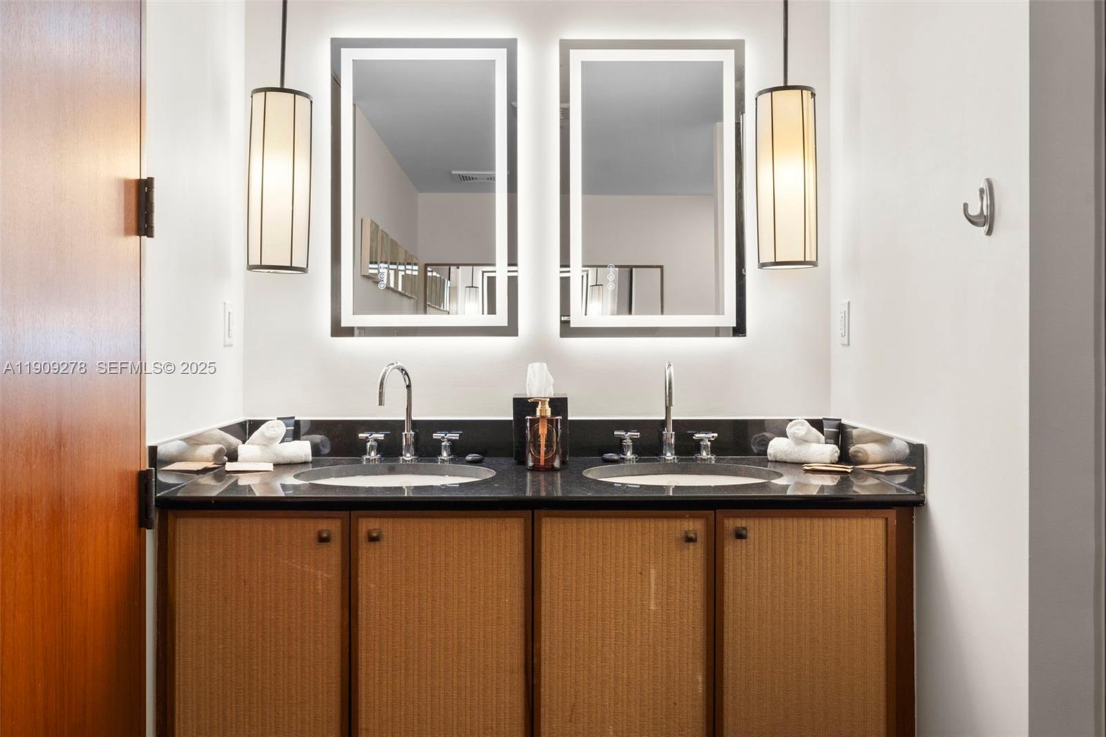 101 20th Street, Unit 3202 Miami Beach, FL 33139 - Photo 34 of 54 a bathroom with a granite countertop sink and a mirror