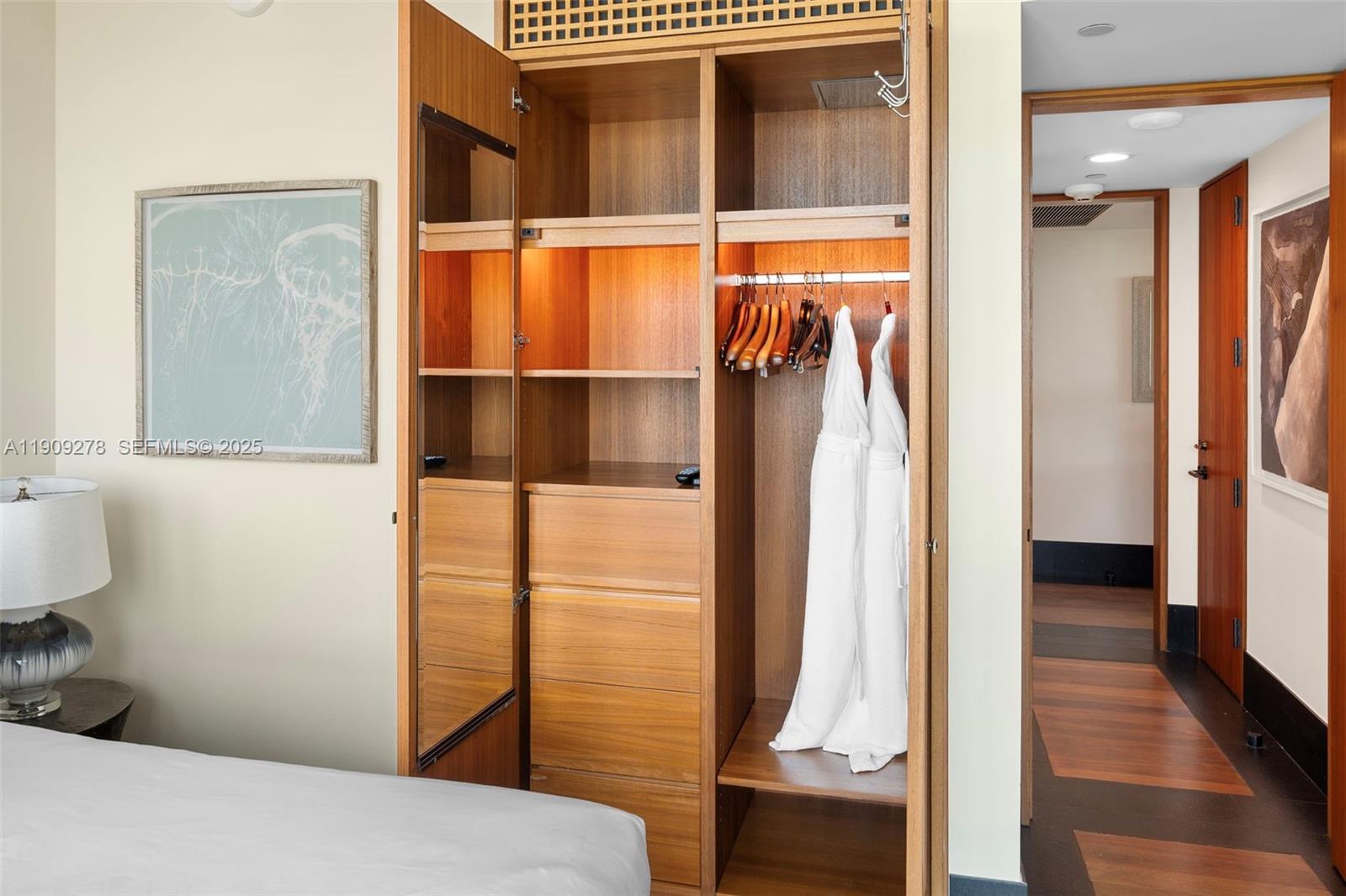 101 20th Street, Unit 3202 Miami Beach, FL 33139 - Photo 42 of 54 a view of walk in closet with clothes and shoes