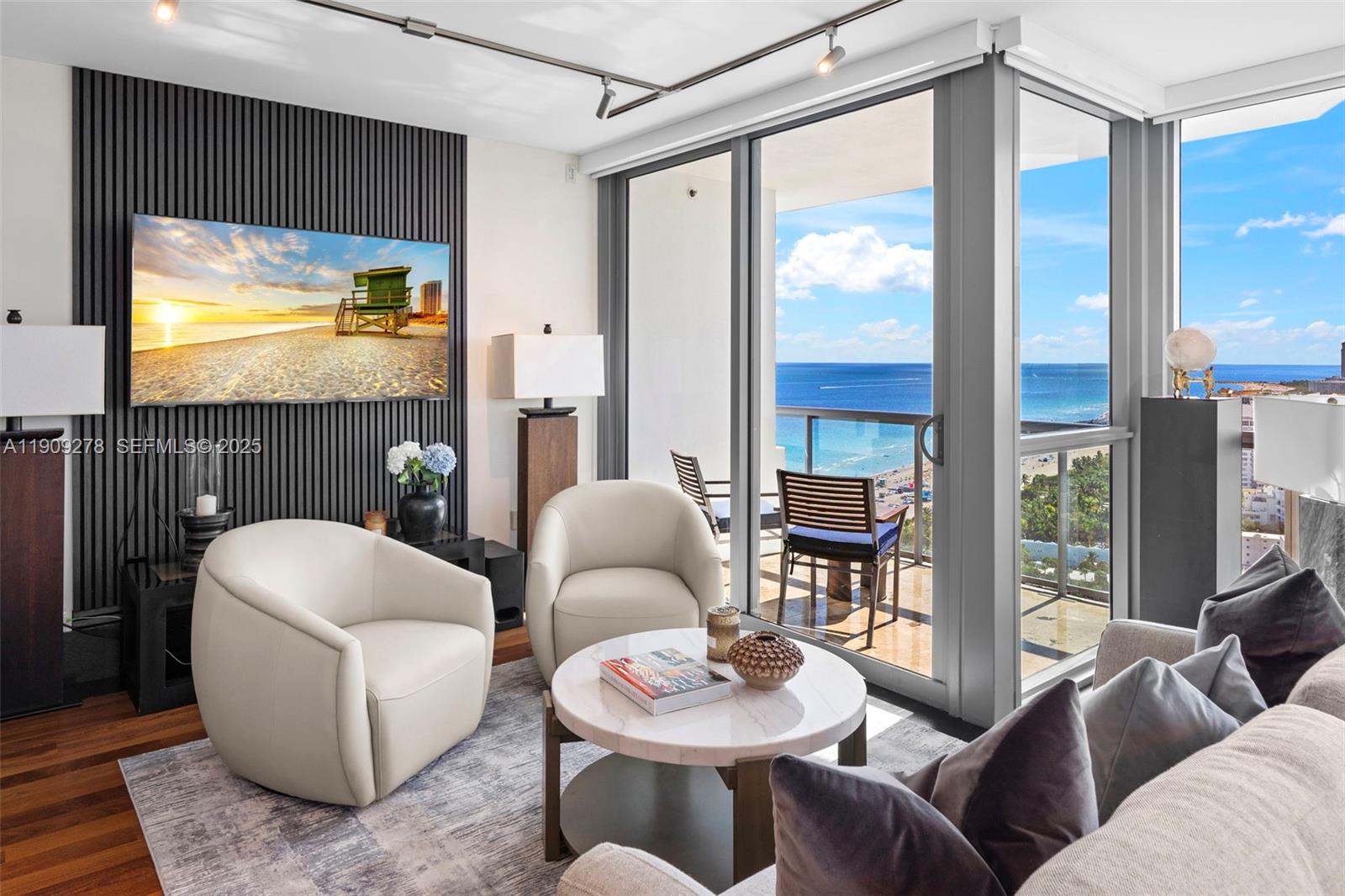 101 20th Street, Unit 3202 Miami Beach, FL 33139 - Photo 8 of 54 a living room with furniture and a floor to ceiling window