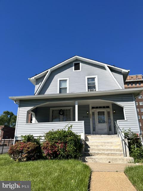 5720 Clover Road Baltimore, MD 21215 - Photo 1 of 1 Charming gray home under a clear sky.