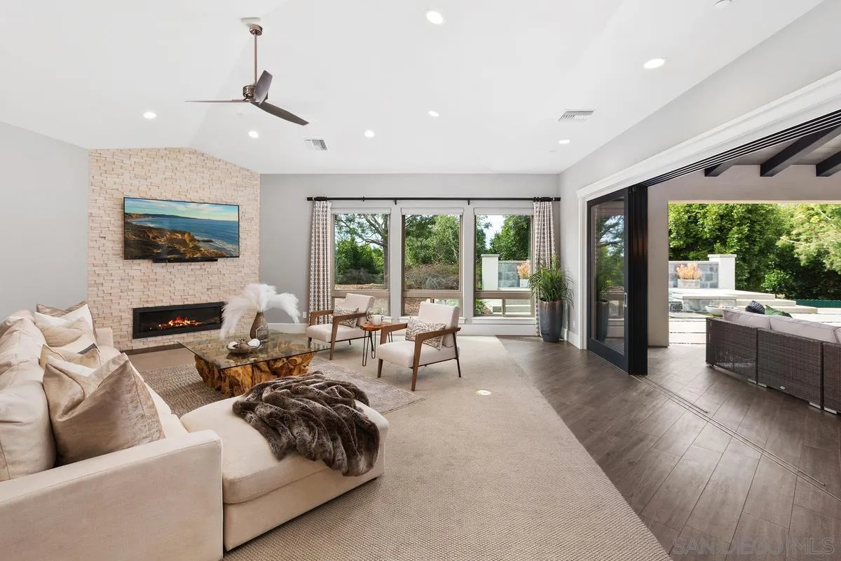 8330 Artesian Road San Diego, CA 92127 - Photo 11 of 26 a living room with furniture and a fireplace