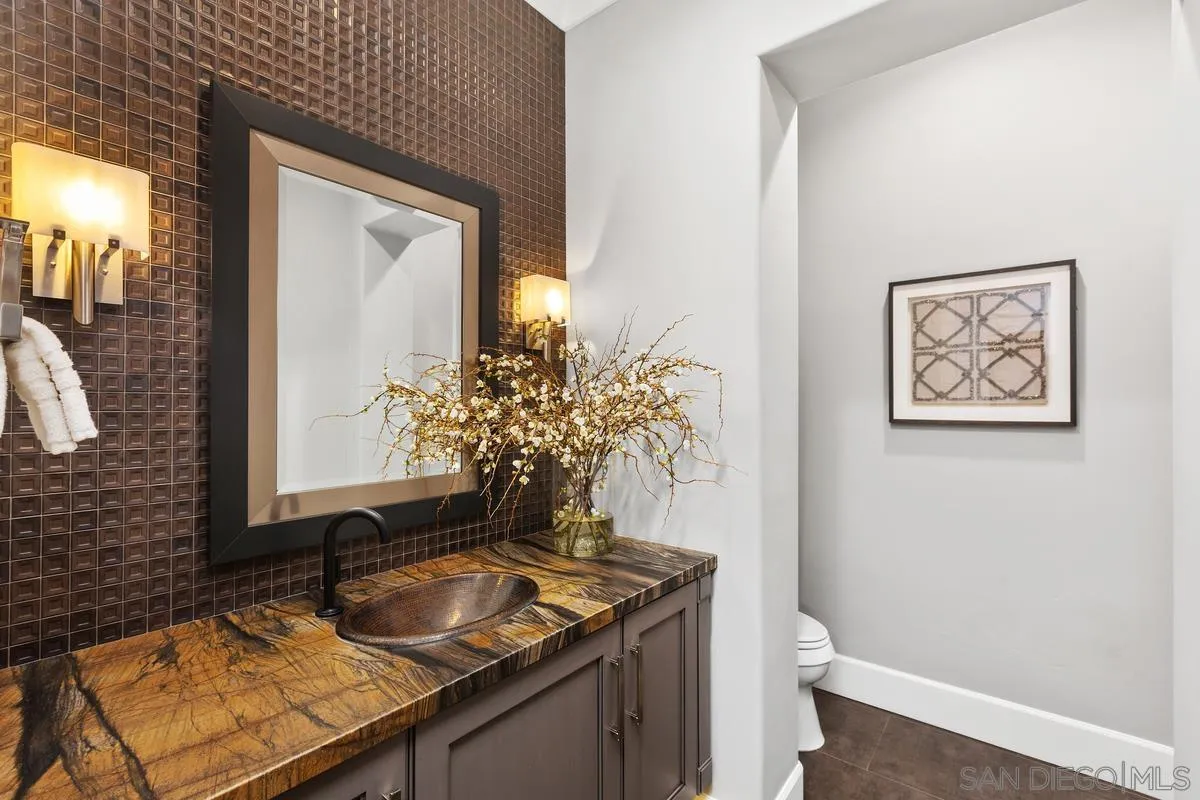8330 Artesian Road San Diego, CA 92127 - Photo 14 of 26 a bathroom with a granite countertop sink and a toilet
