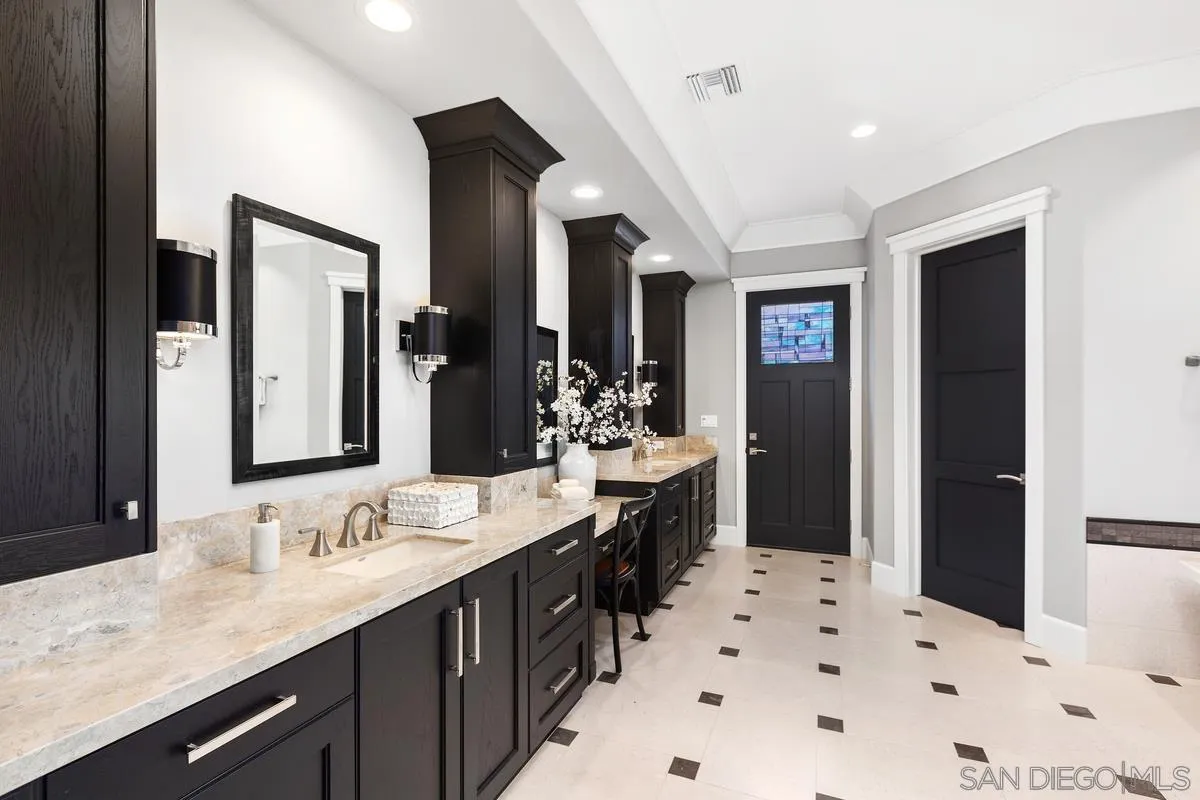 8330 Artesian Road San Diego, CA 92127 - Photo 17 of 26 a bathroom with a sink double vanity granite and a bathtub