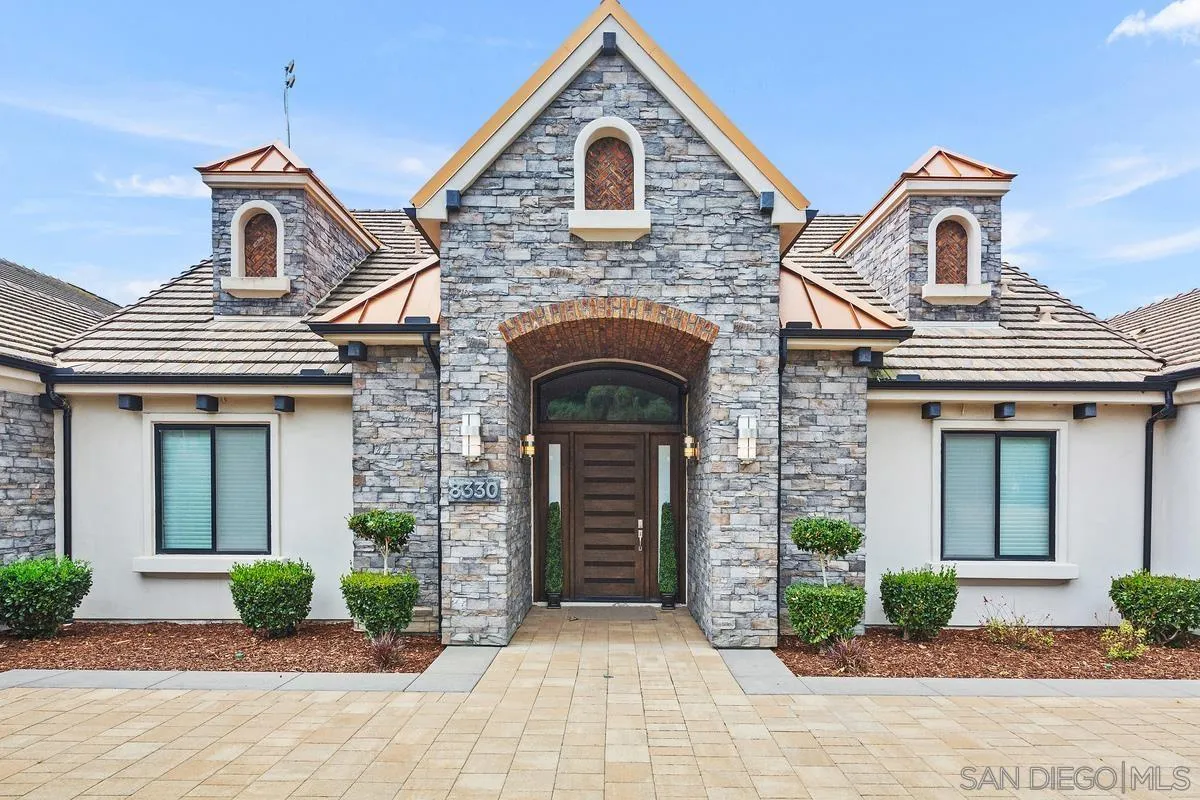 8330 Artesian Road San Diego, CA 92127 - Photo 3 of 26 a front view of a house with garden